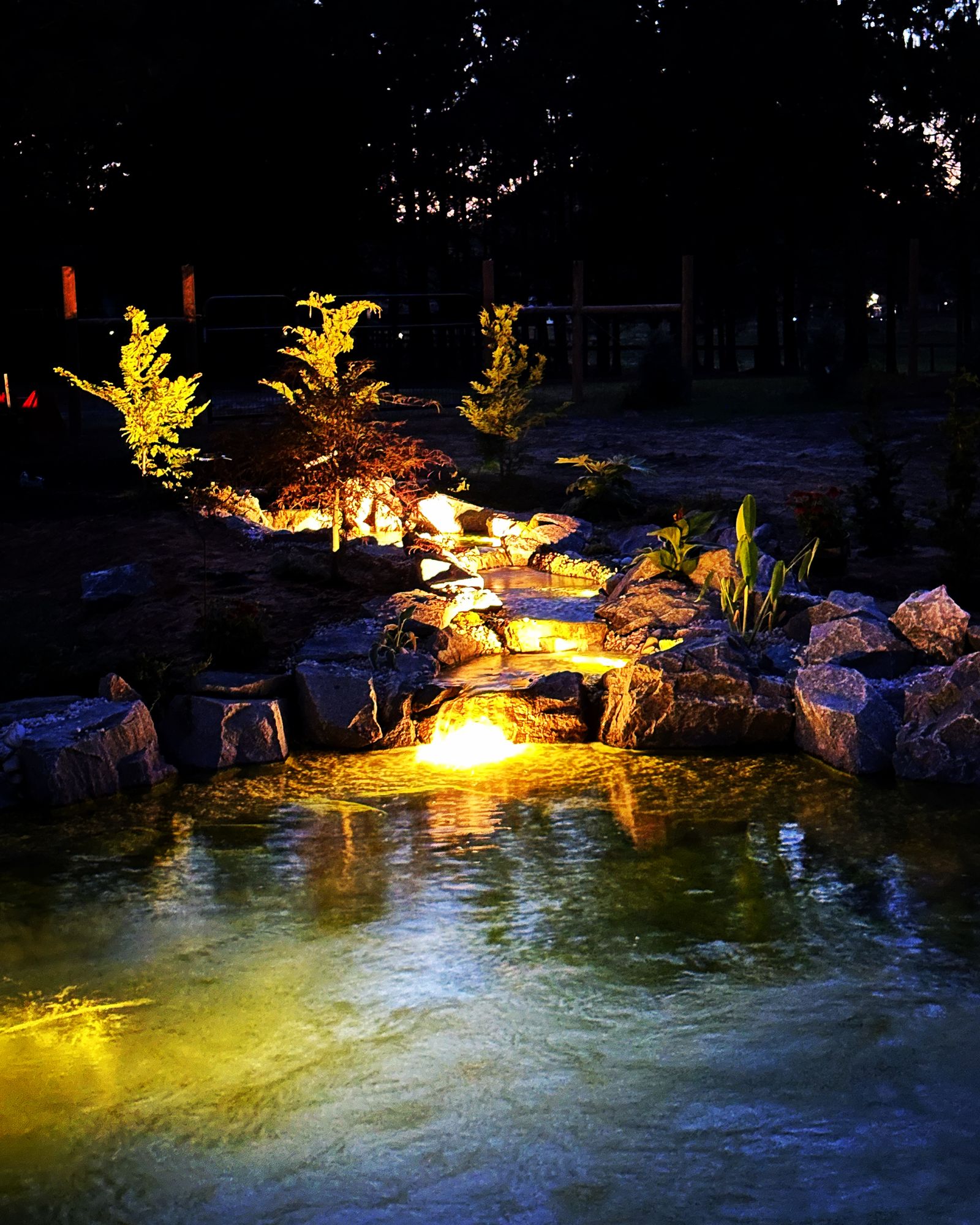 Waterfall lit warm at dusk